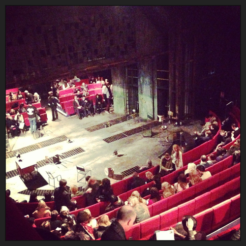 An intimate theater setting. 