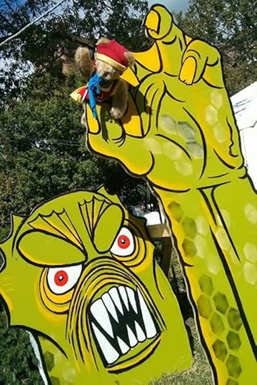 Tristan the Teddy Bear encounters the Monster from the Black Lagoon at the Baltimore Book Festival.