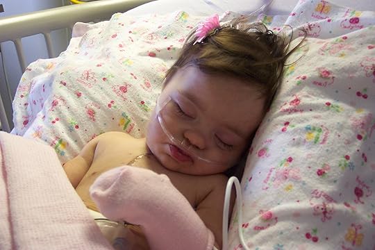 Julianna after heart surgery, age 6 months: Possibly the only time in her life she left a hair bow in her hair.