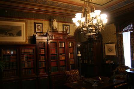 Original gas light chandelier at Glenmont [the library], long ago converted to electricity. Each bulb would have been an open flame.