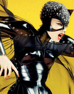Catwoman Movie Costumes and High Fashion: Dolce and Gabanna's take on Catwoman costume for Vogue: complete with the iconic and indispensable cat cowl studded in Swarovski crystals—meow! 