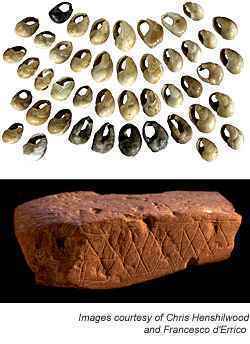 Pierced, dyed beads and incised block of red ochre from Blombos Cave, South Africa
