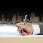 Writing hand in suit.