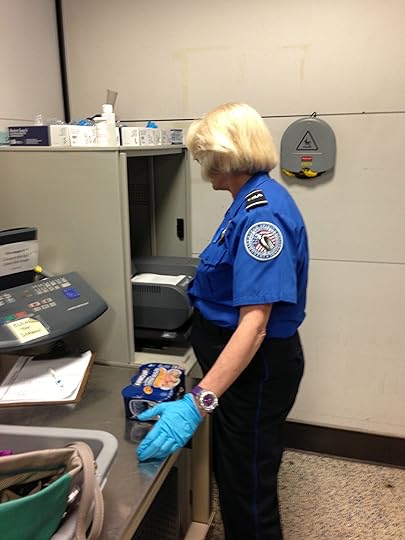 I KID you NOT. They are checking my Vienna Sausages for bomb residue.