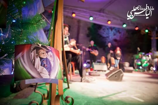 A tree at the main stage in Bethlehem with photos of Palestinian Children killed by Israeli attacks during the last war on Gaza.