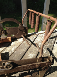 Extracted steel track and frame with emasculated tension springs