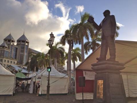 the Port Louis Waterfront, with tables and tents set up for the 10th Mauritius Bookfair
