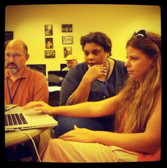 Roxane Gay helps two writers get their websites up at the Midwest Writers Workshop.