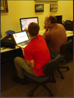 Intern John Carter helps Tony Roberts.