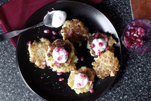 cauliflower fritters with feta, yogurt, pomegranate