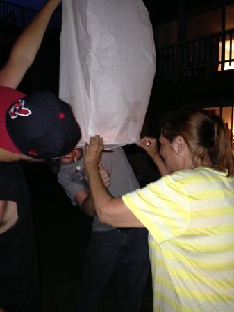 Trying to light the wish lantern.