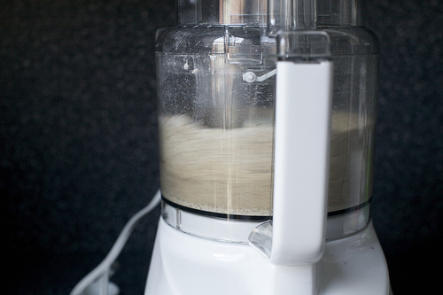 grinding the toasted pecans and flour