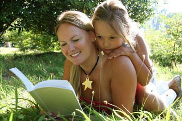 mom_reading_grass_full.jpeg