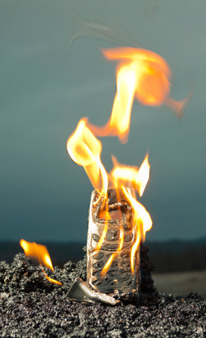 burning cell phone because it's evil and I hate it