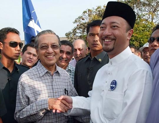Datuk Seri Mukhriz Mahathir (right) with his father Tun Dr Mahathir Mohamad.