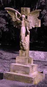 A stone-carved angel grave marker.