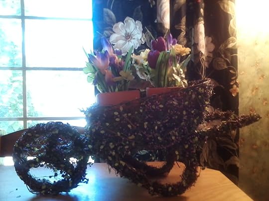 Wheelbarrow with artificial flowers