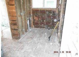 Right now it's been gutted, but that wall on the left will (or already has) disappeared making this one larger room. Not a pretty sight. . . yet.