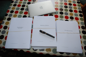 The latest three manuscripts for proofreading with my Visconti on top.