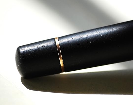 Not very clear in this light, but you can just see the little flecks of mica in the barrel.