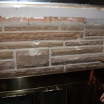 Detail of the holes drilled into the brickwork by the previous owner. These holes must have been used to secure a different mantle, and the white mantle was designed to hide them. I can't even begin to tell you how angry this makes me.