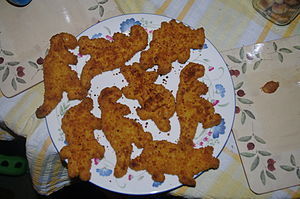 English: Dinosaur formed chicken(?)-nuggets, e...