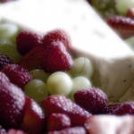 cheese, raspberries strawberries, and grapes