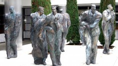 Statues of frozen businessmen