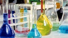 Beakers full of sciencey-looking science liquid, probably being used by scientists to do science. SCIENCE!!