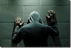 man_facing_wall