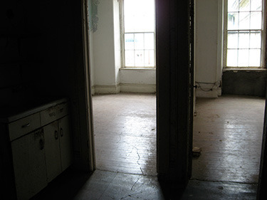 In contrast, here are the nurses' quarters. Each of these two tiny rooms would contain four beds. Eight women who have lived in each room. Since they worked in shifts of 12-hours on, 12-hours off, two women could share a single tiny bed, one sleeping while the other worked.