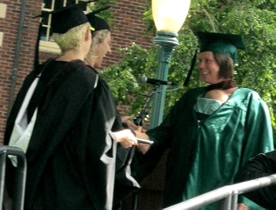 Accepting my degree with Juniper carried in my gown
