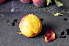 slipping the peach skins off