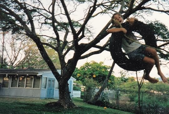 Kid on a tire swing