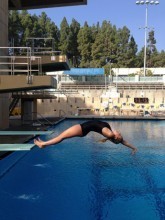 Bethany practices a back dive off the spring board while training at UCLA.