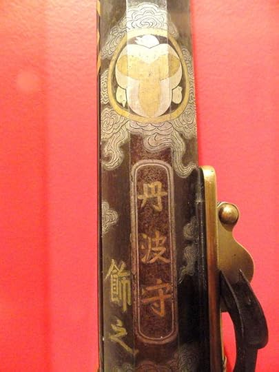 Decoration on the stock of a Teppo, Japanese matchlock gun at the Higgins Armory.