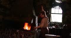 Blacksmith working the bellows