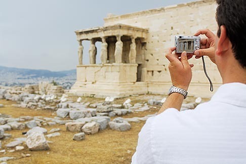 7-640-695 stock photo of Greece, Athens, Acropolis, Tourist photographing the Porch of the Caryatids, Erectheion