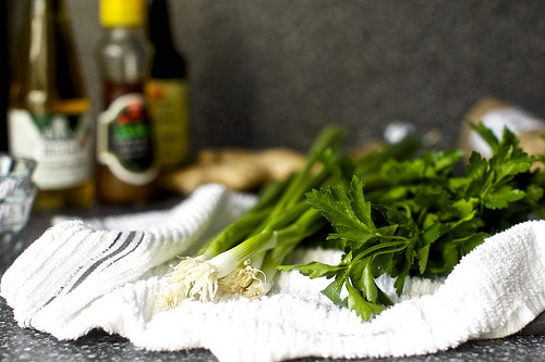 scallions, greens, bottles of stuff