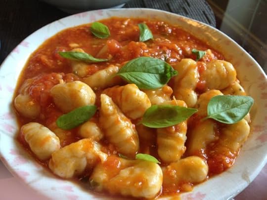 With fresh tomatoes and basil.