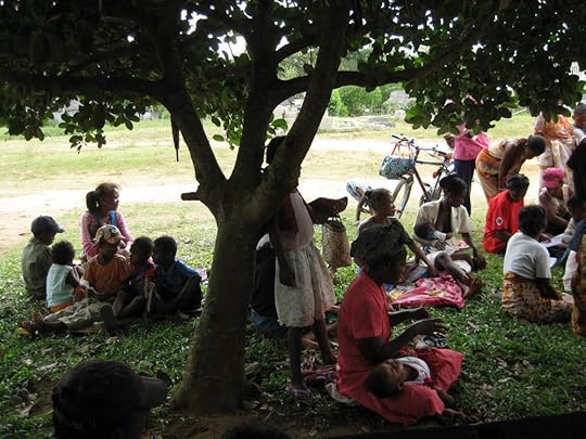Families awaiting clinic opening in the bush village. Some traveled on foot <br />all night to get there for the opening.
