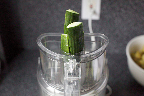 feeding the cuke into the chute