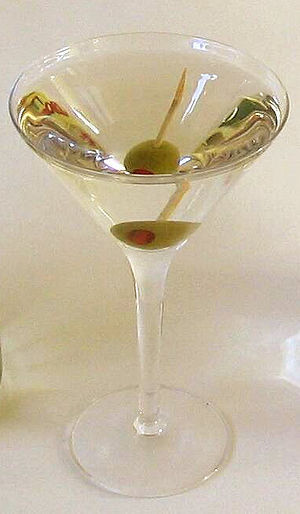 A gin martini, with olive, in a cocktail glass.
