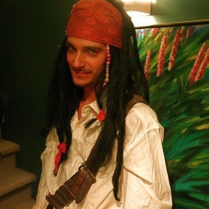 Attractive young man dressed as a pirate.