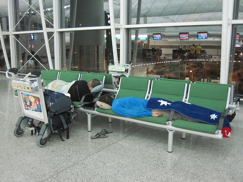 Sleeping at Hong Kong HKG airport.