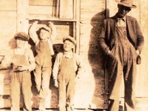 Old photo man and three boys