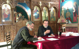 Father Gerasimos and Archbishop Damaskinos at the clergy synaxis on 13 December 2012