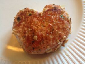 Somewhat heart-shaped salmon burger