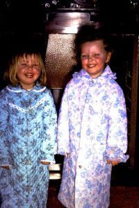 In front of the fireplace. (I'm on the right.)