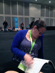 Tiffany is browsing the BEA booklet we got while waiting to get in to see Neil.